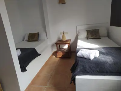 Cama o camas de una habitación en Hotel Rural La Marmita de Ahlam