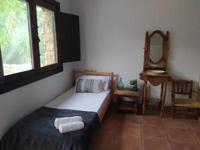 Cama o camas de una habitación en Hotel Rural La Marmita de Ahlam