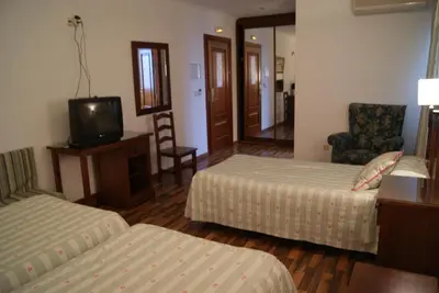 Cama o camas de una habitación en Hotel Mulhacen