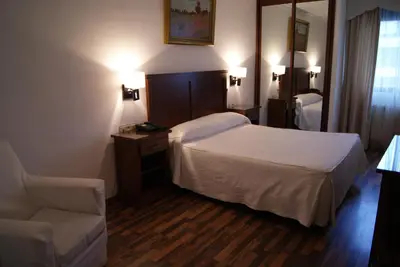 Cama o camas de una habitación en Hotel Mulhacen