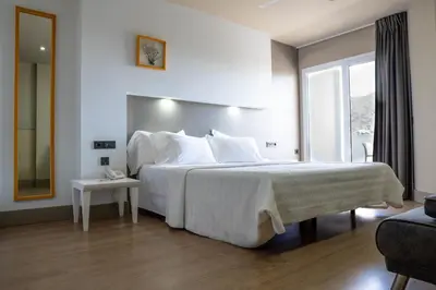 Cama o camas de una habitación en Hotel MC San José