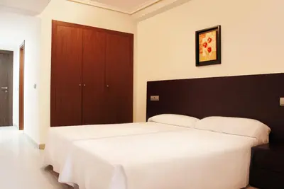 Cama o camas de una habitación en Complejo Turístico Marina Rey