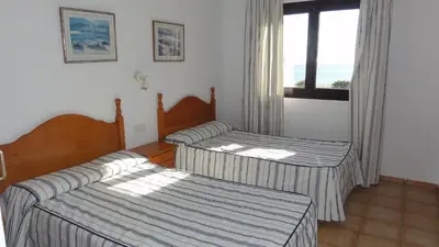 Cama o camas de una habitación en Apartamentos Estrella De Mar