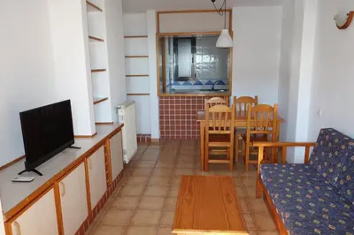 Una televisión o centro de entretenimiento en Apartamentos Estrella De Mar