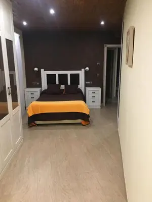 Cama o camas de una habitación en Hostal Mulhacén