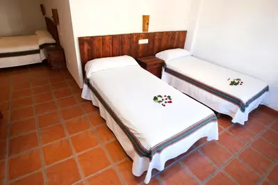 Cama o camas de una habitación en Hostal Mulhacén