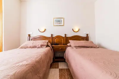 Cama o camas de una habitación en Hotel Sevilla