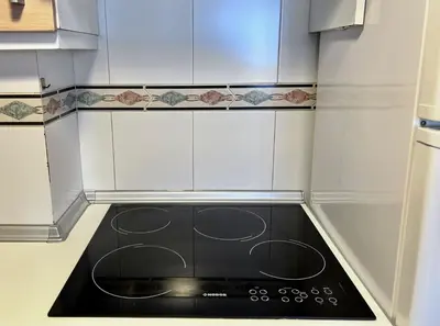 Una cocina o zona de cocina en Apartamentos Arcos Céntrico