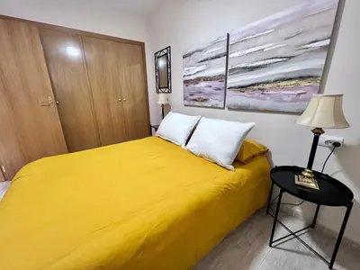 Cama o camas de una habitación en Apartamentos Arcos Céntrico