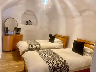 Cama o camas de una habitación en Cuevas Helena