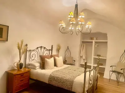 Cama o camas de una habitación en Cuevas Helena