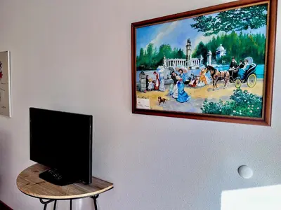 Una televisión o centro de entretenimiento en Apartamentos Arcos Costa Cálida