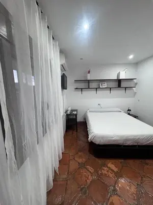 Cama o camas de una habitación en La Hacienda del Marquesado