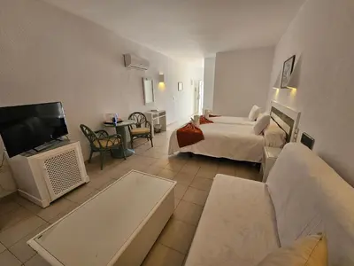 Cama o camas de una habitación en Hotel Puntazo II