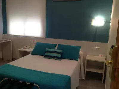 Cama o camas de una habitación en Hotel Felix