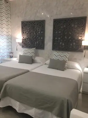 Cama o camas de una habitación en Hotel Felix