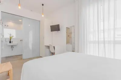 Cama o camas de una habitación en Hostal La Isla