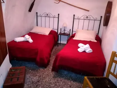 Cama o camas de una habitación en Cueva El Murallon Benamaurel