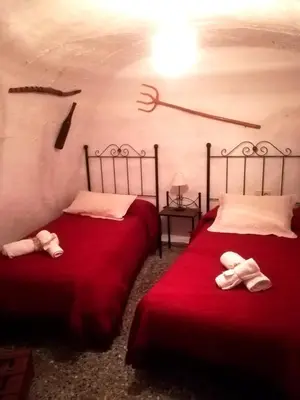 Cama o camas de una habitación en Cueva El Murallon Benamaurel