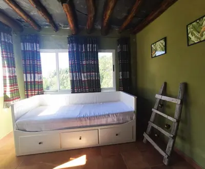 Cama o camas de una habitación en Acogedor alojamiento Trevelez