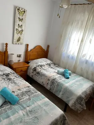 Cama o camas de una habitación en Sunny Breeze Apartment