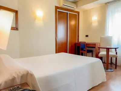 Cama o camas de una habitación en Torreluz Apartamentos