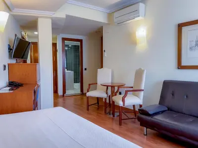 Una televisión o centro de entretenimiento en Torreluz Apartamentos
