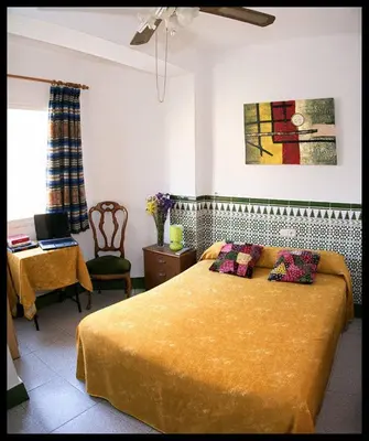 Cama o camas de una habitación en Hostal Estación