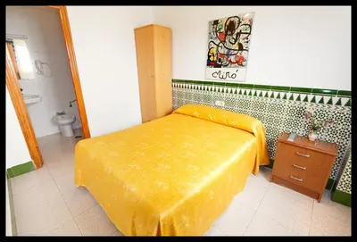 Cama o camas de una habitación en Hostal Estación