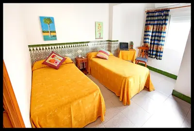 Cama o camas de una habitación en Hostal Estación