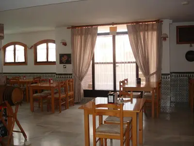 Un restaurante o sitio para comer en Fenix Apartamentos