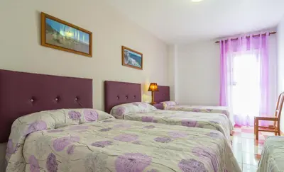 Cama o camas de una habitación en Hostal Rural Alba