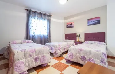 Cama o camas de una habitación en Hostal Rural Alba