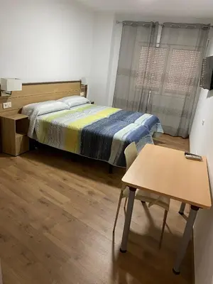 Cama o camas de una habitación en La Escapada