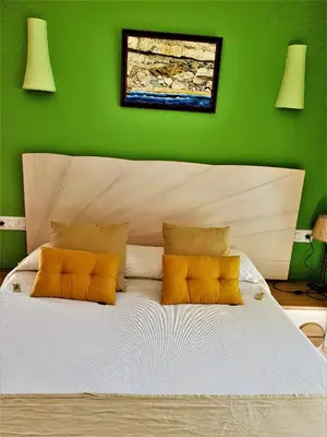 Cama o camas de una habitación en Hotel las Calas