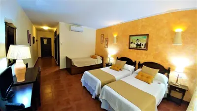 Cama o camas de una habitación en Hotel las Calas