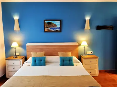 Cama o camas de una habitación en Hotel las Calas