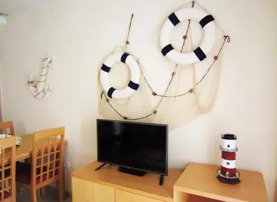 Una televisión o centro de entretenimiento en Tu Hogar en Verazul