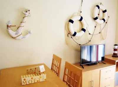 Una televisión o centro de entretenimiento en Tu Hogar en Verazul