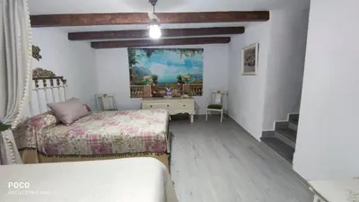 Cama o camas de una habitación en Cueva de la abuela