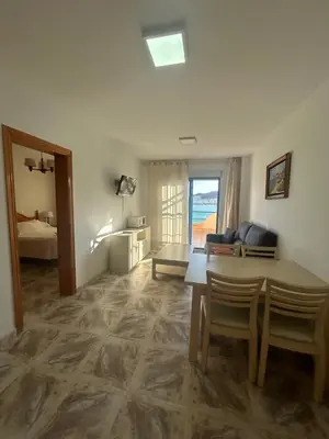 Cama o camas de una habitación en Viviendas turísticas Salomé