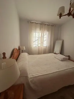 Cama o camas de una habitación en Viviendas turísticas Salomé