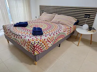 Cama o camas de una habitación en Apartamento Almerimar primera linea de playa