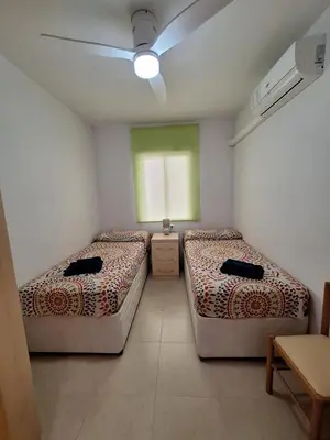Cama o camas de una habitación en Apartamento Almerimar primera linea de playa