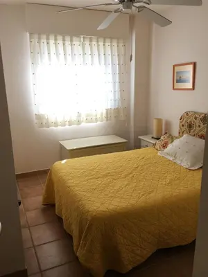 Cama o camas de una habitación en Apartamentos Arcos Calabardina