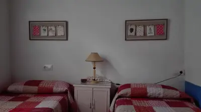 Cama o camas de una habitación en la casa de Isabel