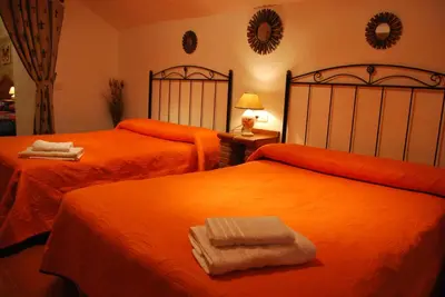 Cama o camas de una habitación en Cueva El Jaraiz