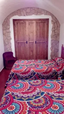 Cama o camas de una habitación en Cueva El Jaraiz