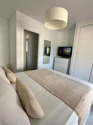 Cama o camas de una habitación en Apartamentos Roquetas Beach