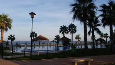 Piscina en o cerca de Primera Linea De Playa